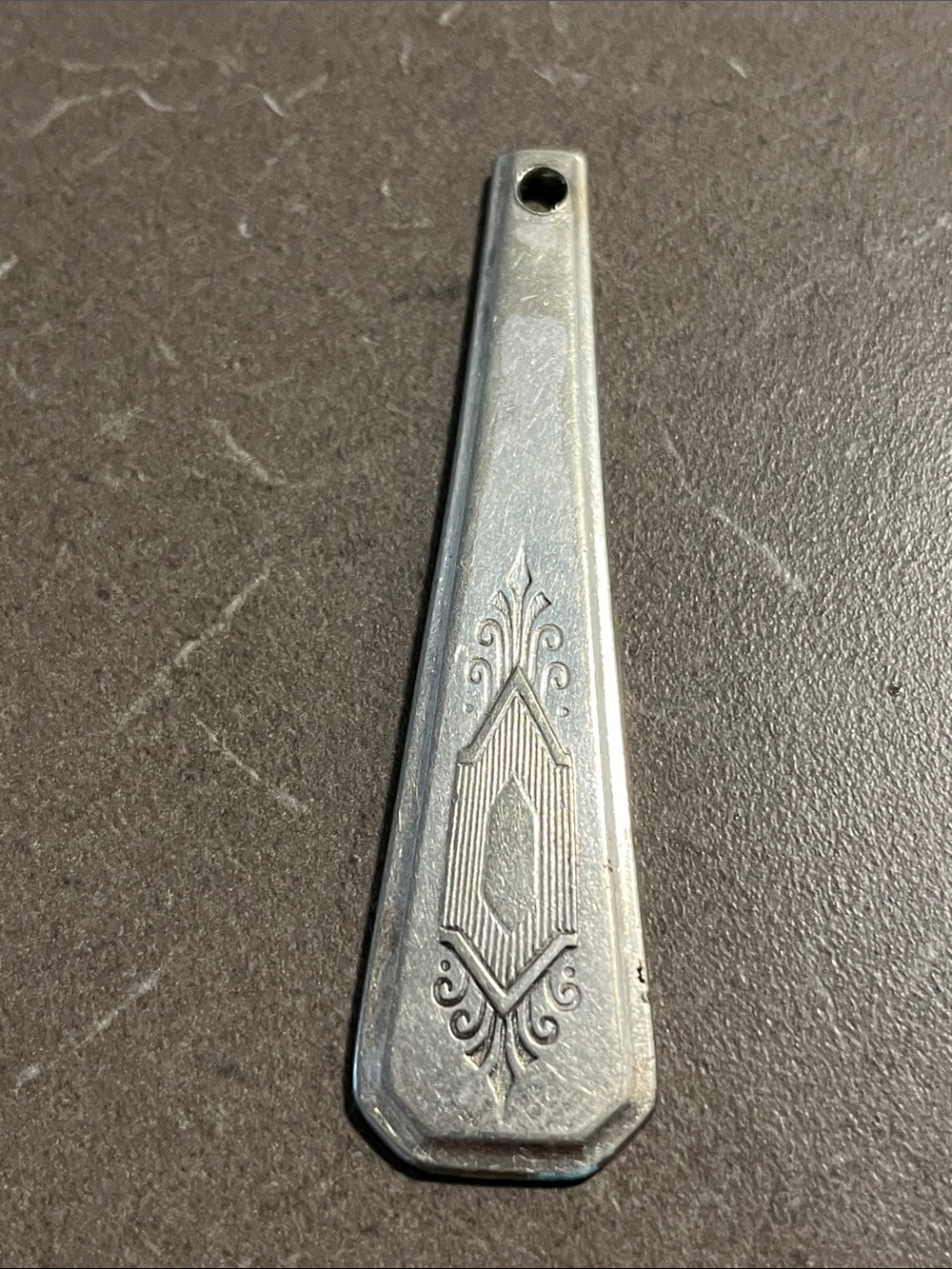 Hand made pendant made out of silver/silver tone flatware